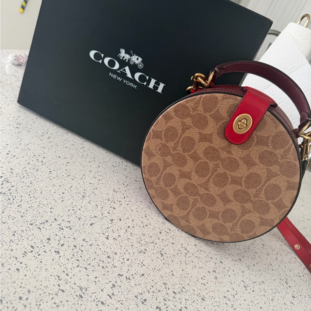 Coach Brown Signature Round Crossbody with Red Trim
